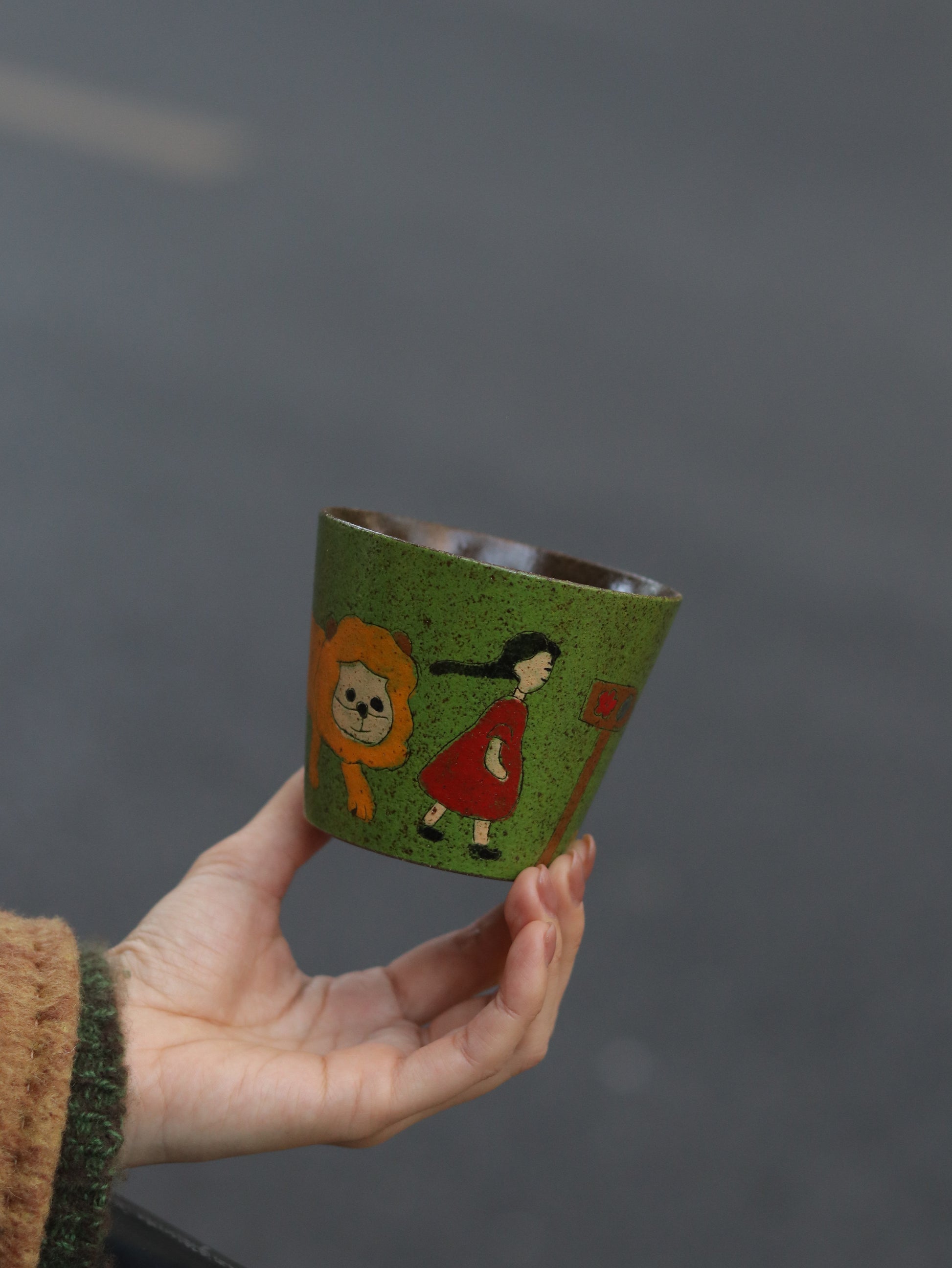 Side view of the 270ml hand-painted storybook ceramic cup
