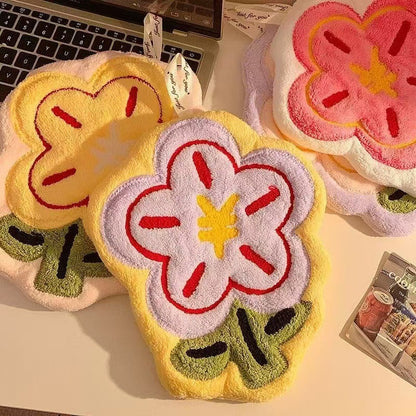 Flower Hand Towel-Floral design phone cases on a desk with a laptop in the background