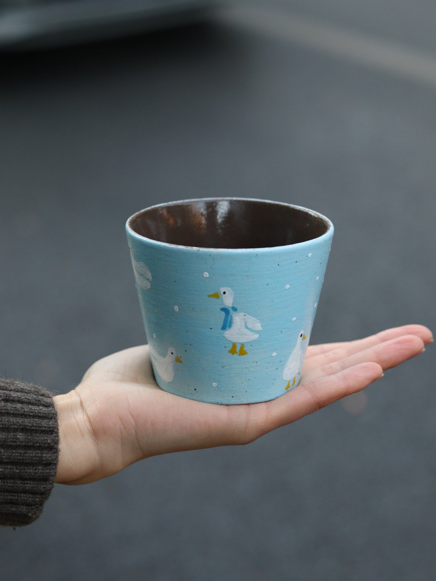 Goose Parade ceramic cup side view