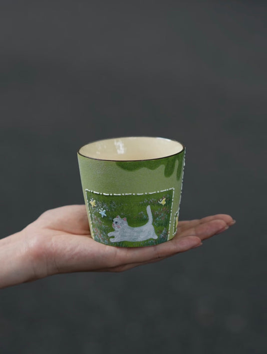 Butterfly Chase hand-painted cat ceramic cup with textured green finish