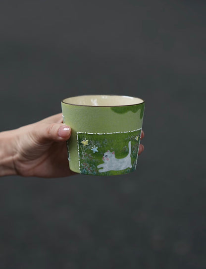 Back of the ceramic cup featuring a hand-painted flower garden