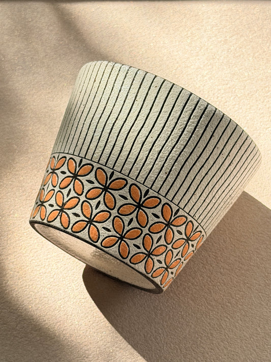 Hand-carved 270ml ceramic cup with orange floral band and fine black vertical stripes